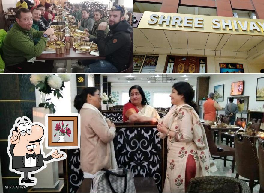 Take a seat at one of the tables at Shree Shivay Thali Dining Varanasi