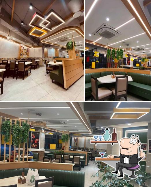 Take a seat at one of the tables at Biryani queen Take a seat at one of the tables at Biryani queen