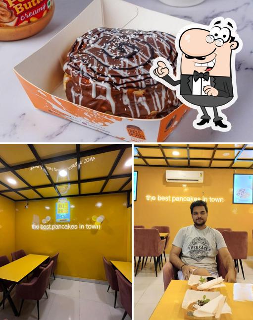 This is the picture showing interior and food at Uncle Peter's Pancakes