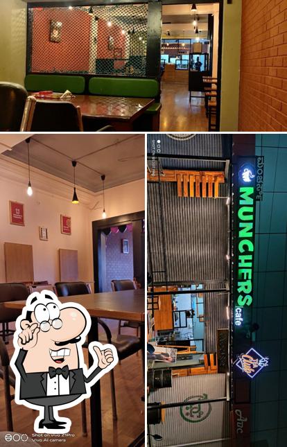 Take a seat at one of the tables at Munchers Cafe