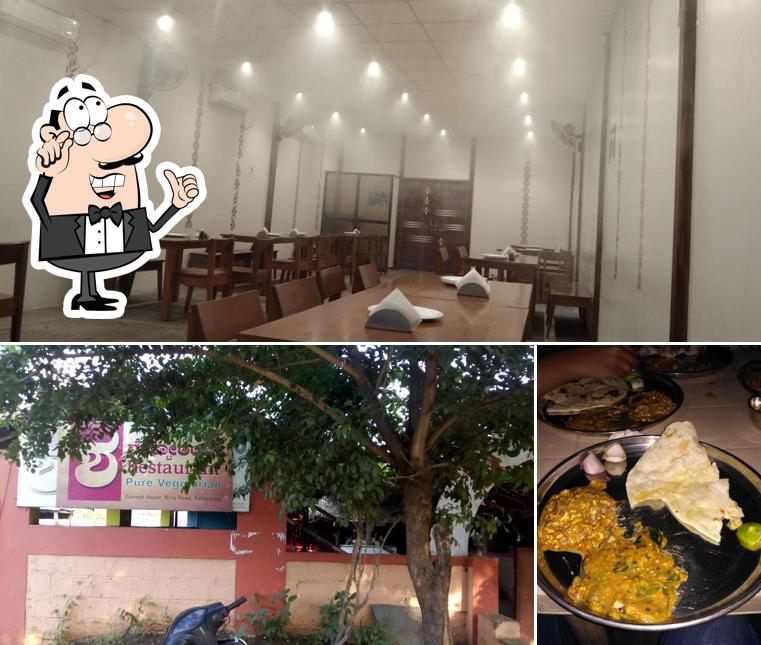 Take a seat at one of the tables at Sha Brindavana Restaurant & Banquet Hall