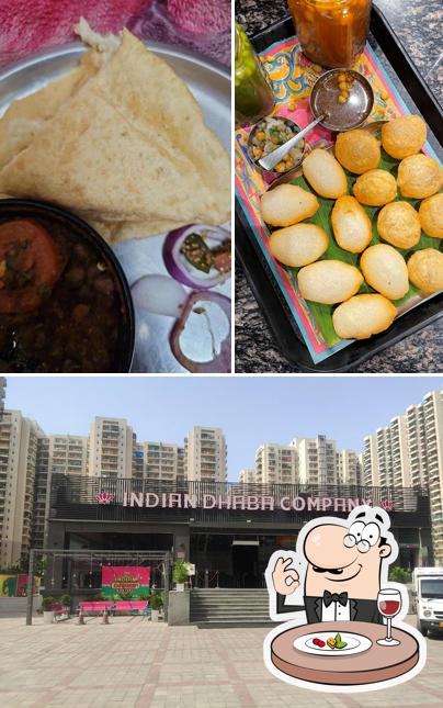 Check out the picture showing food and exterior at Indian Dhaba Company
