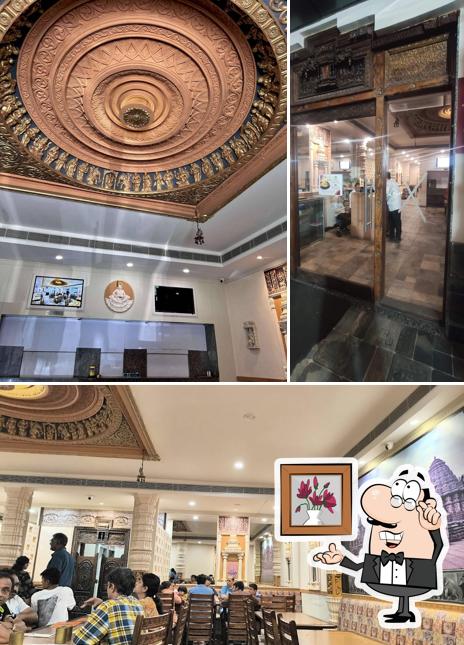 Take a seat at one of the tables at Annpoornam Fast food