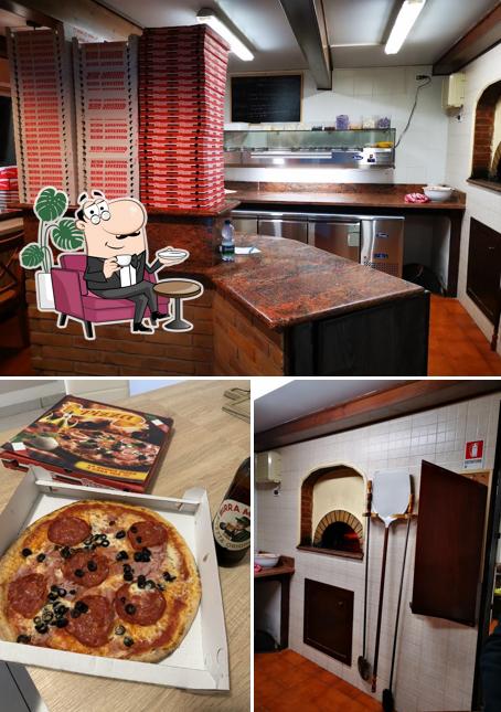 Questa è la foto che mostra la interni e pizza di Pizzeria Albachiara