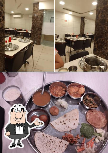 Among various things one can find interior and food at Sajan Dining Hall
