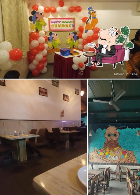 Take a seat at one of the tables at Blue Waters-Lounge Bar and Fine Dining