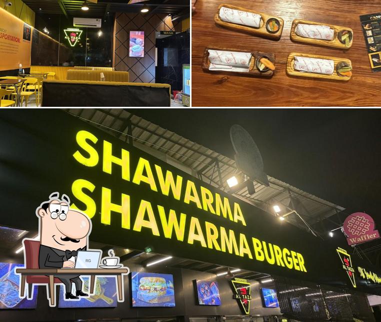 Take a seat at one of the tables at Al Taza - Kaloor