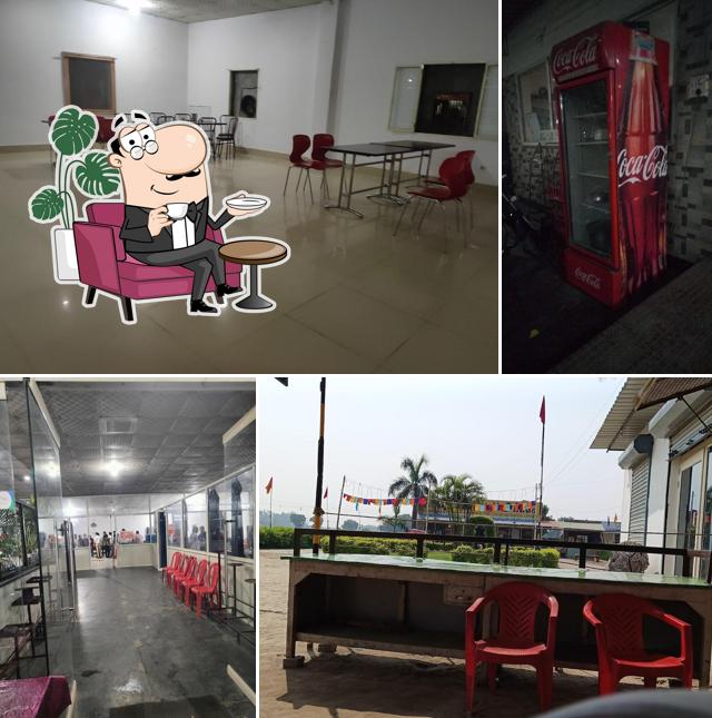 Take a seat at one of the tables at New Red Chilli Dhaba Restaurant