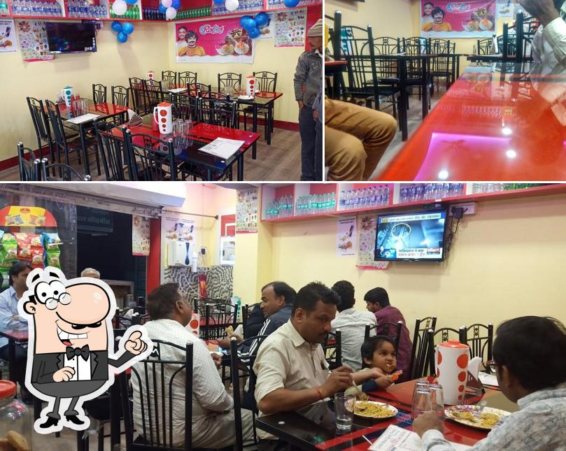 Take a seat at one of the tables at Little Bites Quick Foods