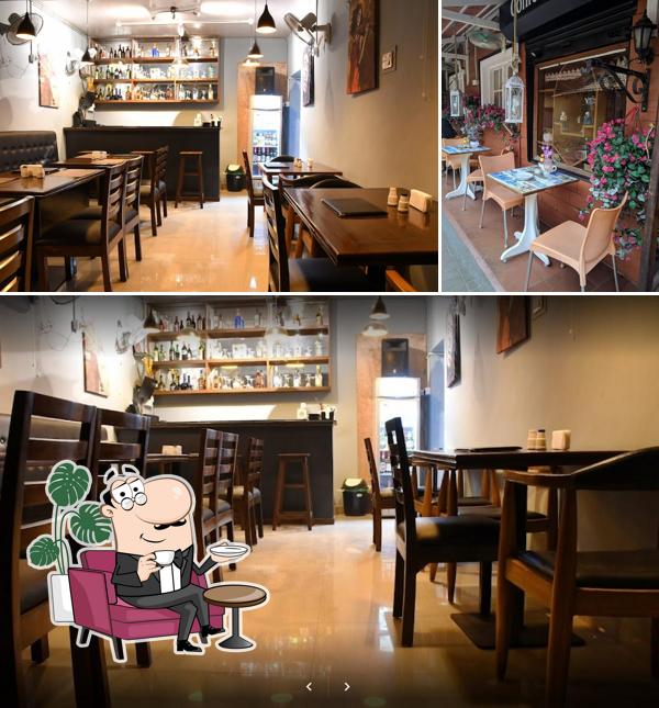 Take a seat at one of the tables at 21st Jan Bar & Restaurant