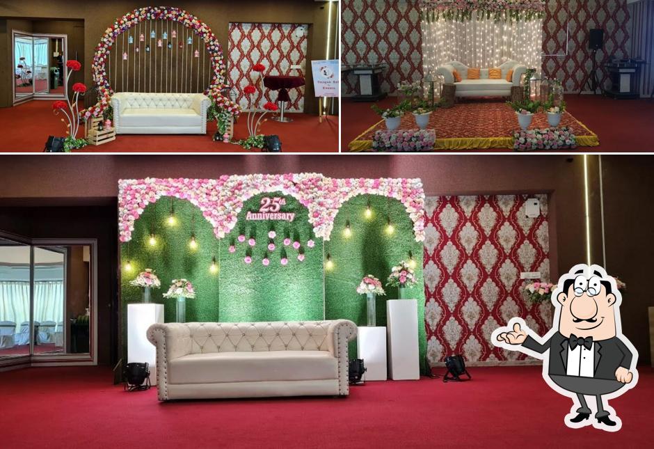 Take a seat at one of the tables at La Terranza-Roof top Restaurant & Banquet