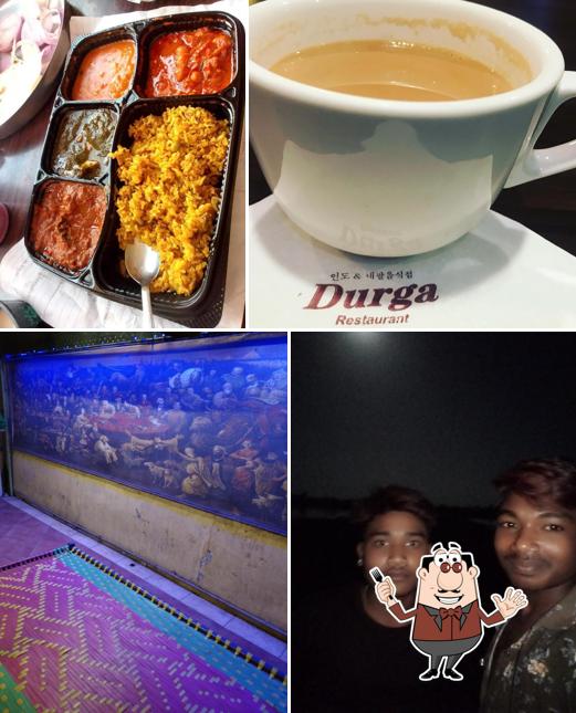 The photo of Durga Restaurant’s food and exterior