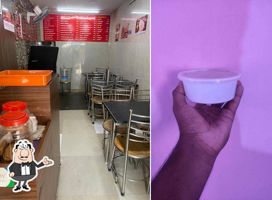 Take a seat at one of the tables at MADRASI MESS