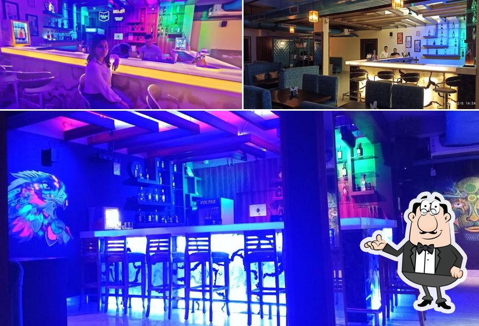 Take a seat at one of the tables at 99 HINTS: Bar & Lounge