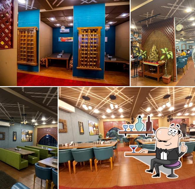 Take a seat at one of the tables at The Taste Of Bharuch - Shree Khodiyar Kathiyawadi Dhaba