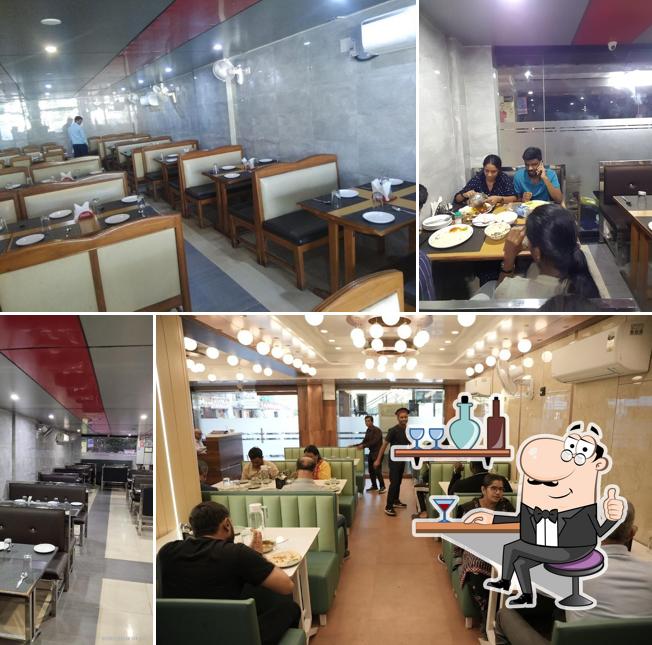 Take a seat at one of the tables at Dawat Restaurant