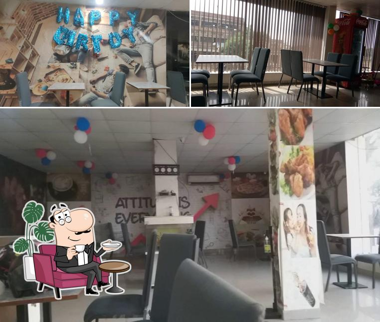 Take a seat at one of the tables at Attitude Cafe and Restaurant NXT