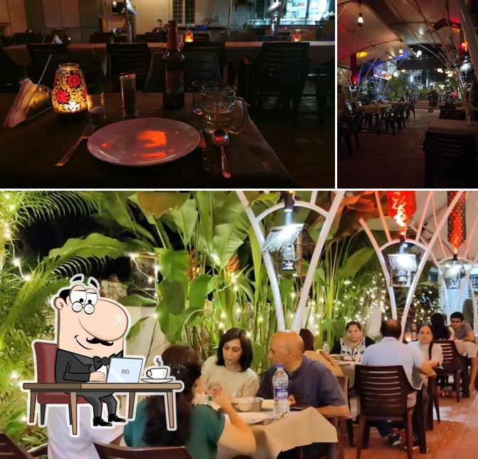 Take a seat at one of the tables at The Garden Restaurant