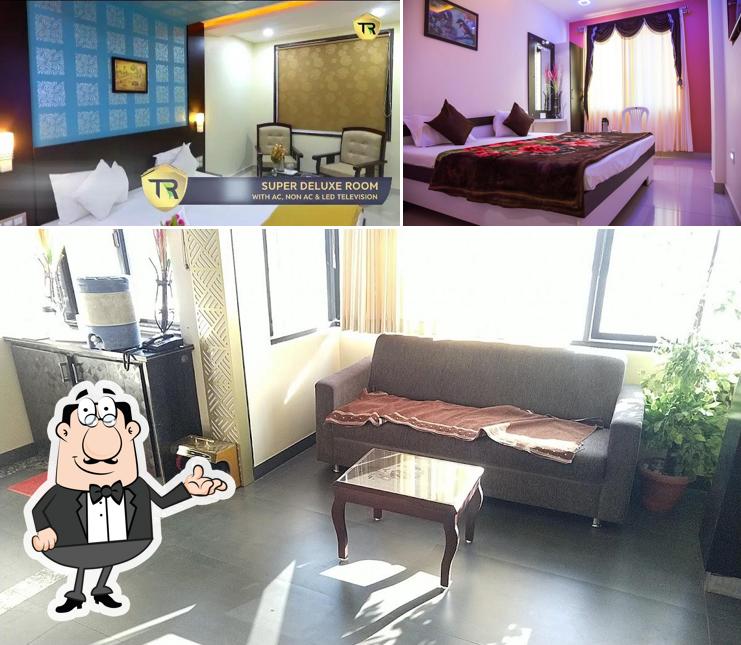 Take a seat at one of the tables at Hotel Tulsi Residency