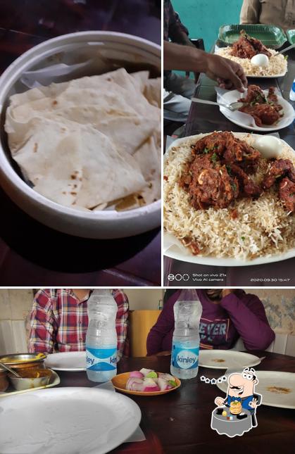 Among different things one can find food and dining table at New Taj Dhaba Restaurant
