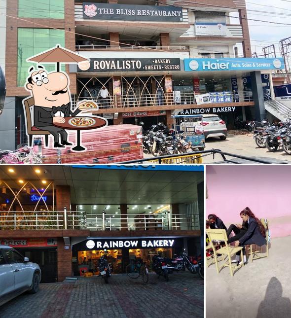Take a look at the picture depicting exterior and interior at Rainbow bakery