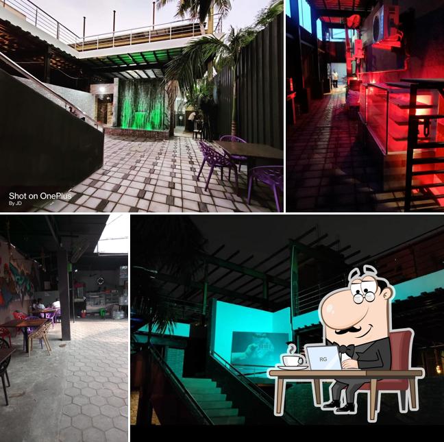 Take a seat at one of the tables at Three Monkeys Resto Bar