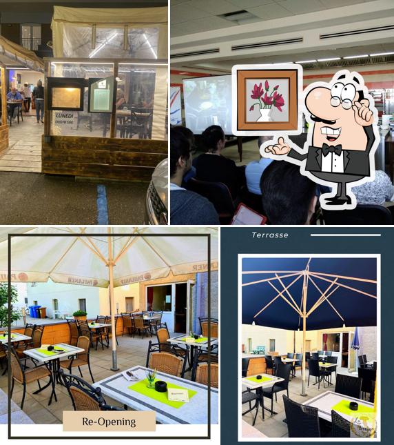 Dai un'occhiata agli interni di Pizzeria La Taverna