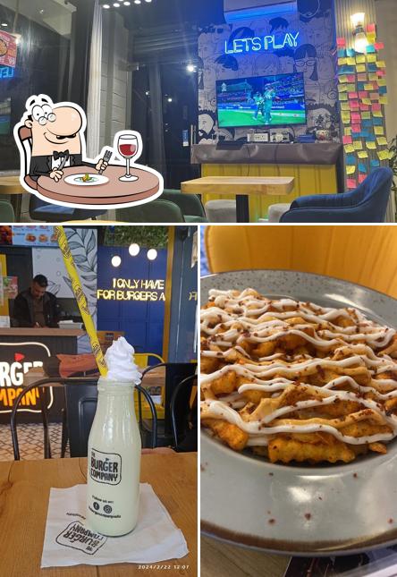 Take a look at the picture showing food and interior at The burger company