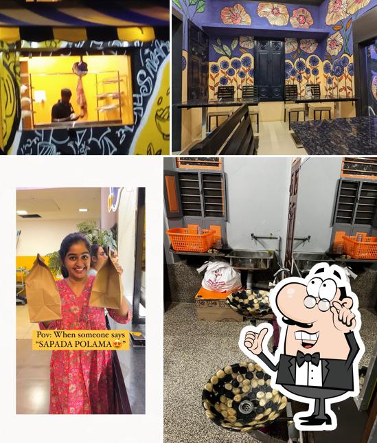 Take a seat at one of the tables at Dosa Infinity Sivakasi