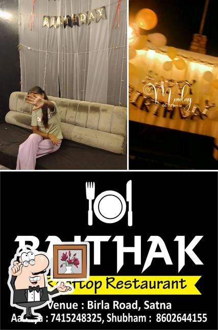 Take a seat at one of the tables at Baithak a Family Restaurant & Cafe