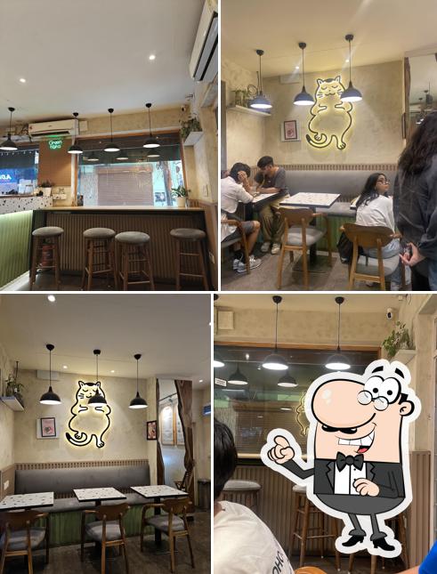 Take a seat at one of the tables at Green Neko (Boba Tea Ramen and Poke bowl)