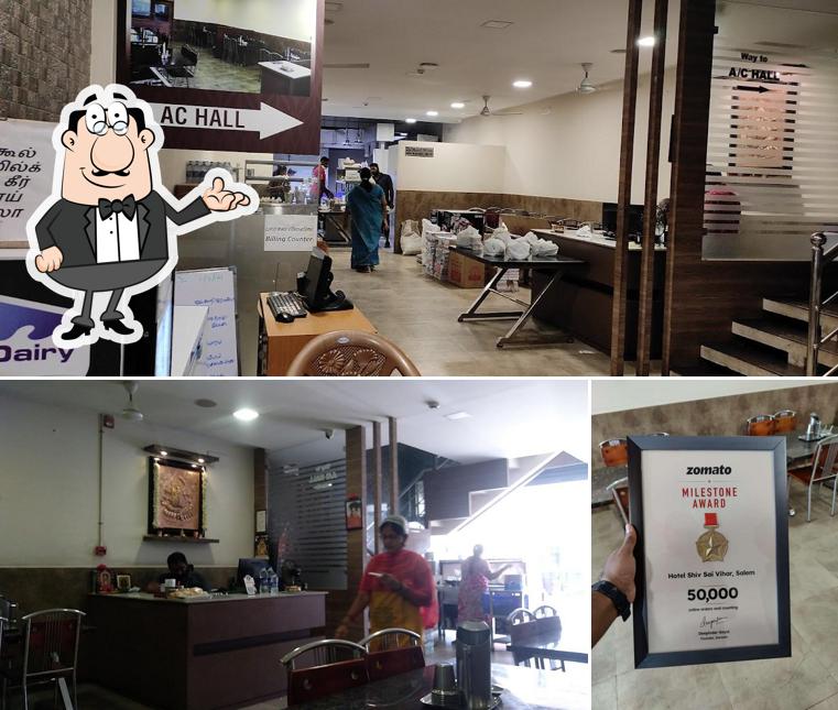 Take a seat at one of the tables at Hotel Shiv Sai Vihar