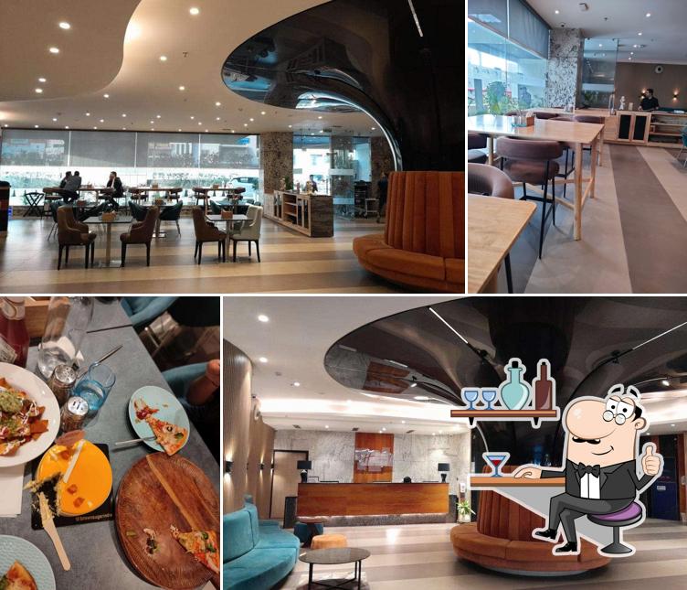 Take a seat at one of the tables at Nosh 24*7