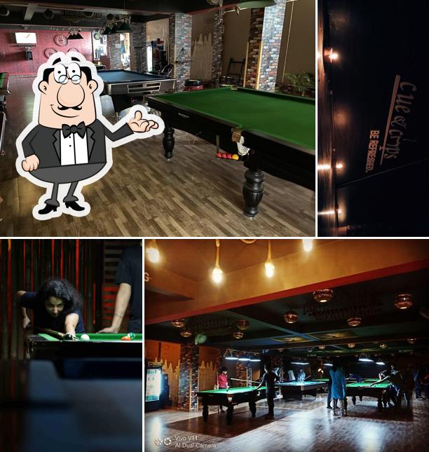 Take a seat at one of the tables at Cue & Cups