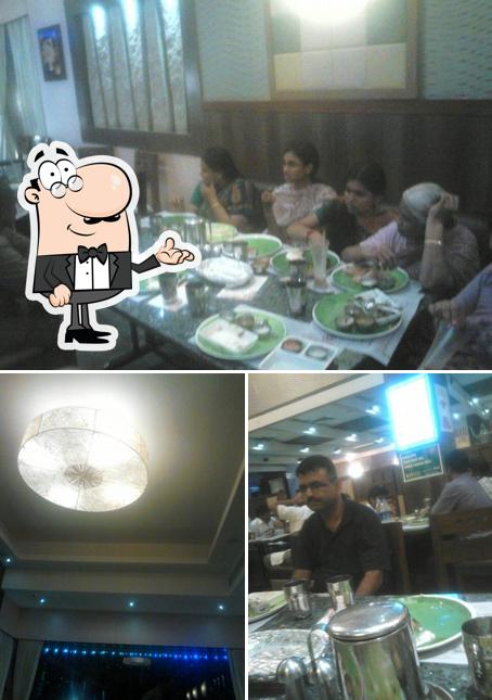 This is the image displaying interior and dining table at Sangeethas Restaurant