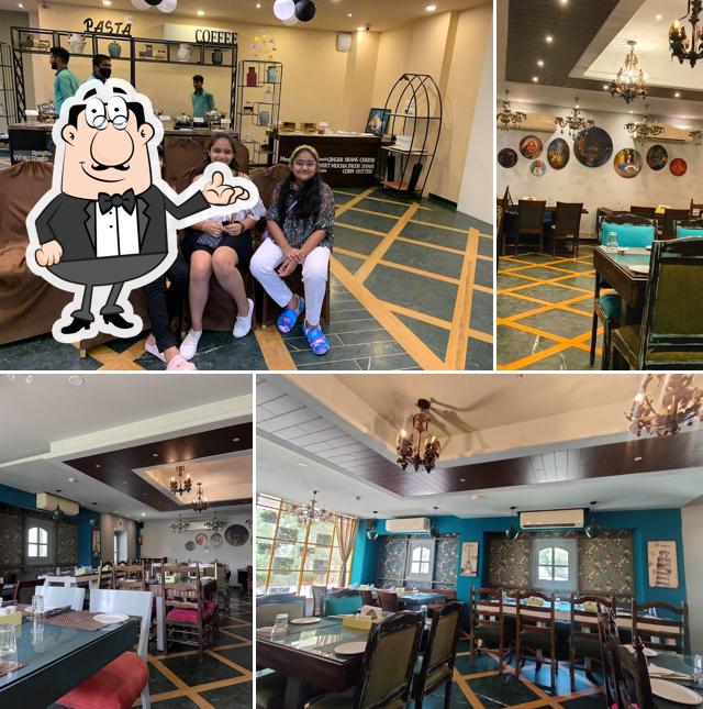 Take a seat at one of the tables at RD'S Infusion Global Veg Kitchen Fine Dining Restaurant