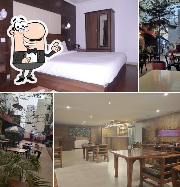 Take a seat at one of the tables at HOTEL RENUKA INN