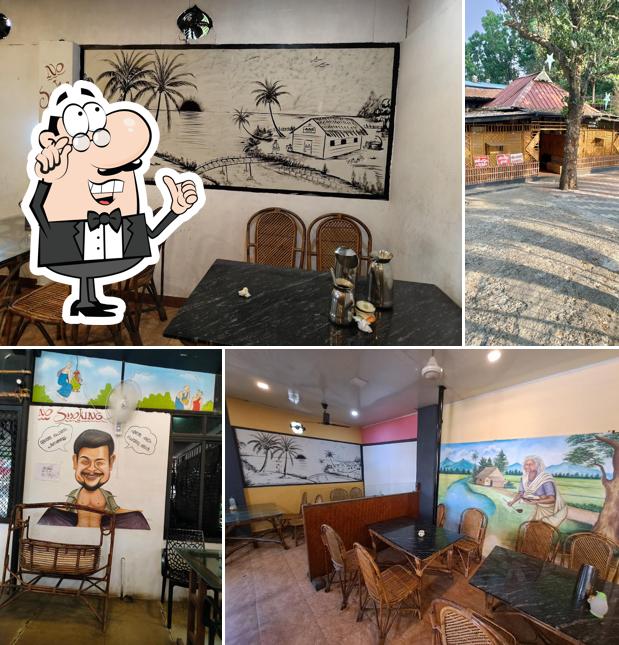 Take a seat at one of the tables at Plavinchuvattil Restaurant Shaap Curry Toddy Shop Family Restaurant Seminarypadi Aluva