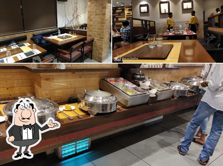 Barbeque Ville - Wakad is distinguished by interior and dining table