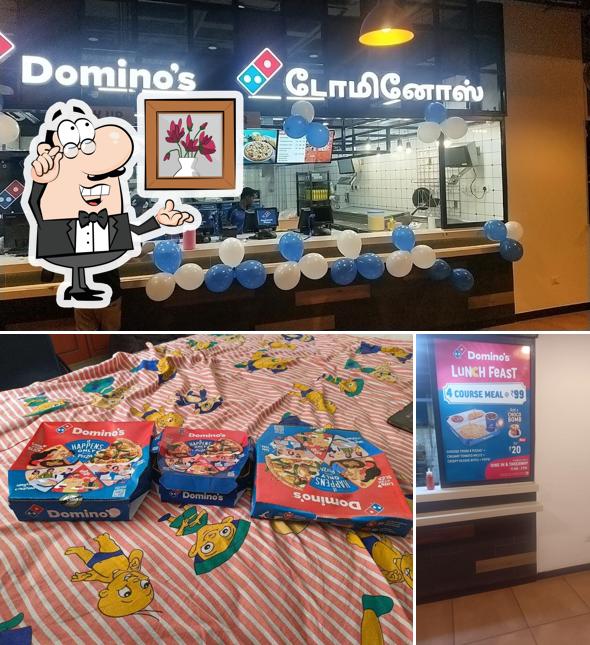 Take a seat at one of the tables at Domino's Pizza Kancheepuram, Chennai