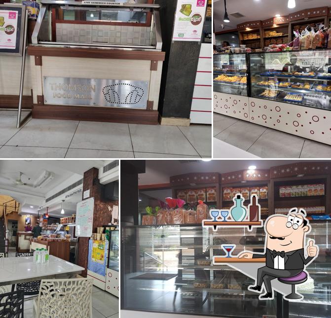 Take a seat at one of the tables at Thomson Food Mall Thiruvalla
