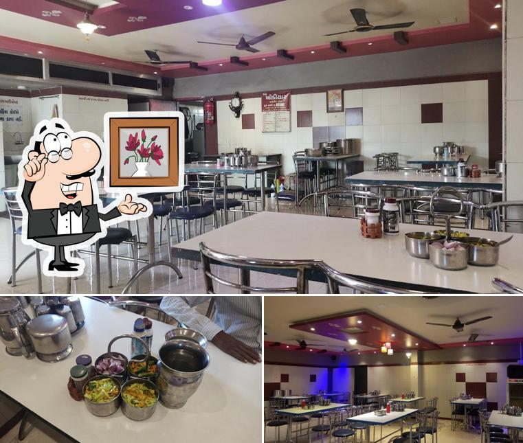 Among various things one can find interior and food at JAY KHODIYAR DINING HALL