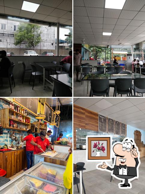 Take a seat at one of the tables at Telugu Spice Kitchen