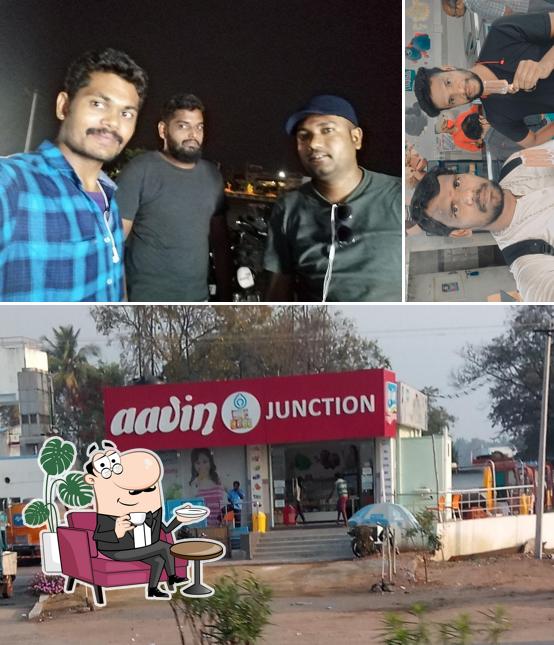 Take a seat at one of the tables at Aavin Junction