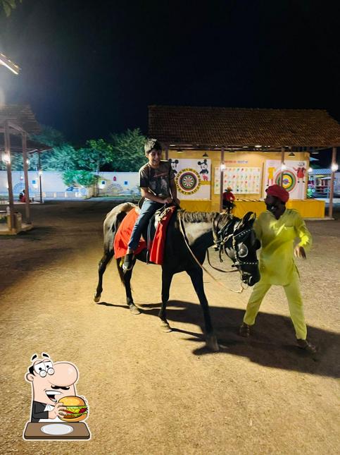 Try out a burger at Chokar Dhani, Raipur