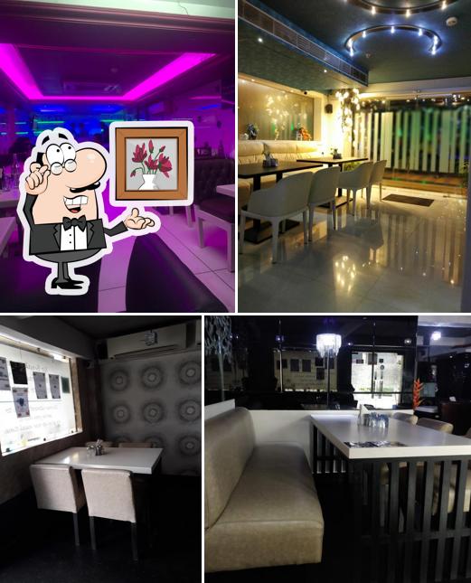 Take a seat at one of the tables at Cheeni Kum Restaurant - Kasba