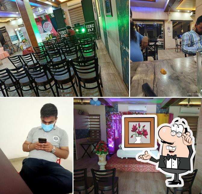 Take a seat at one of the tables at Daawat Restaurant & Dhaba