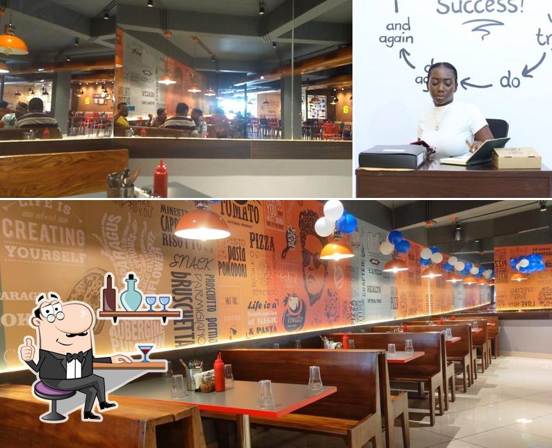 Take a seat at one of the tables at Pizza Zone Morbi