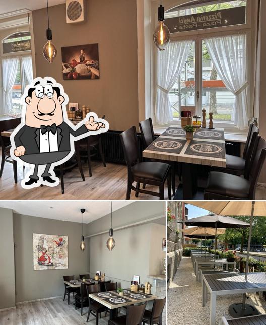 Questa è la immagine che raffigura la interni e esterno di Pizzeria Amici