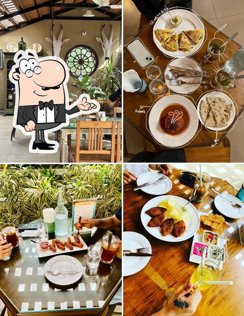 Take a seat at one of the tables at The Café at Saanchi - Authentic Persian Cuisine & Silk Route Aroma - Dining Experience